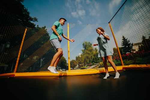 Outdoor trampolining by supermodel couple